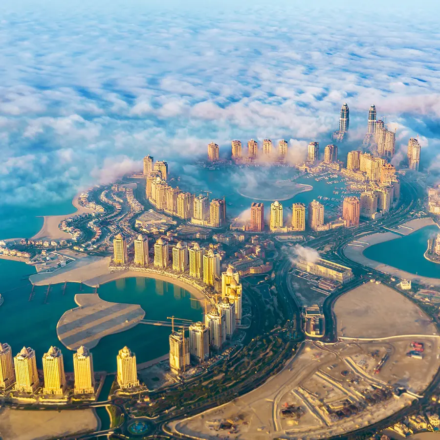 aerial view of the pearl-qatar island in doha through the morning fog - qatar the persian gulf
