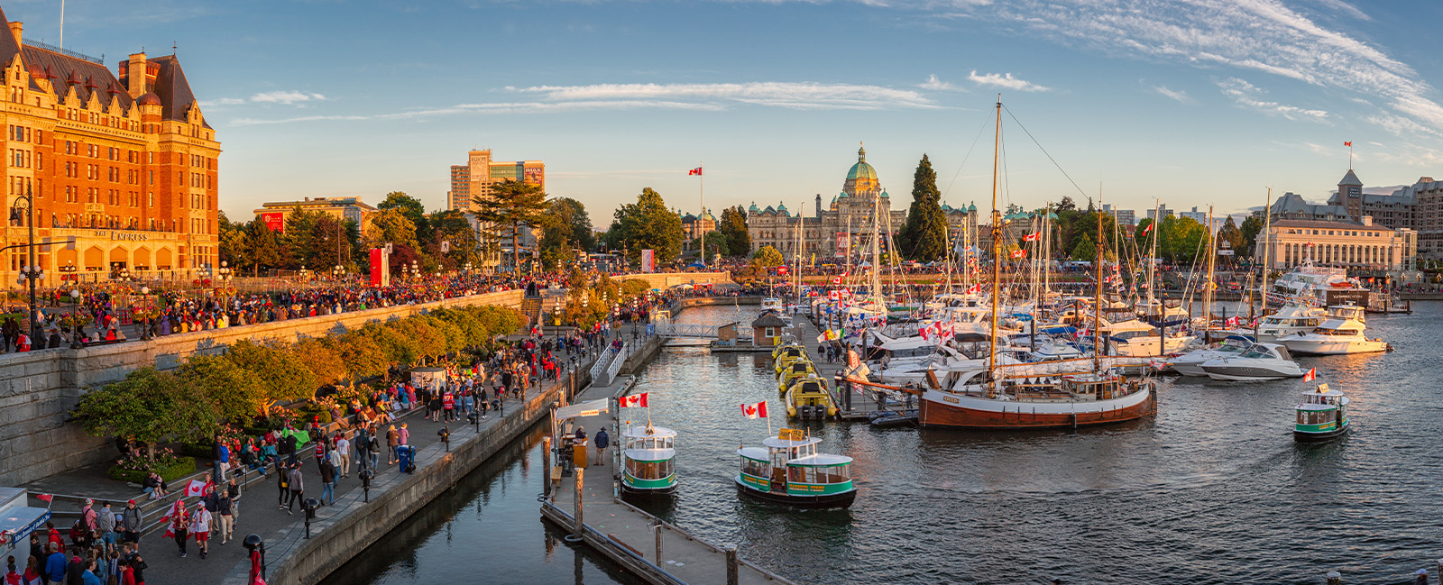 Canada-Day-in-Victoria-Vancouver-Island-Canada.-Masses-of-people-visiting-the-celebrations-at-inner-harbour-with-the-parliament-building-during-sunset