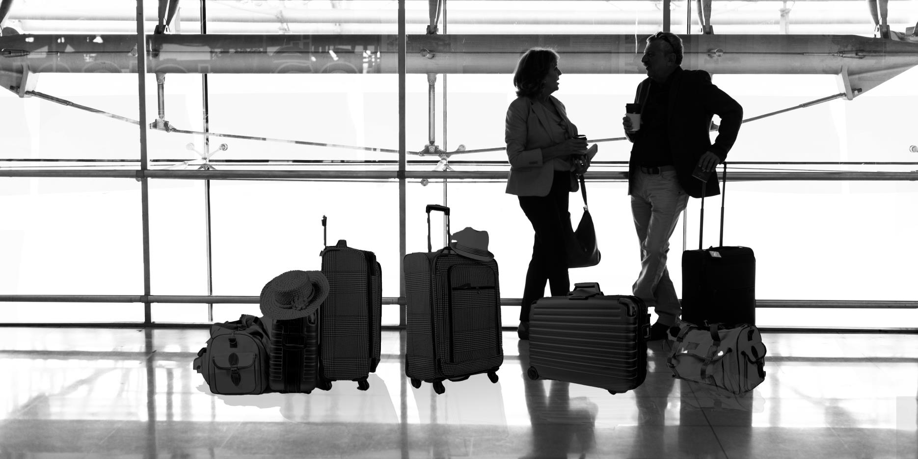 caucasian-couple-is-talking-together-airport with-excess-luggage