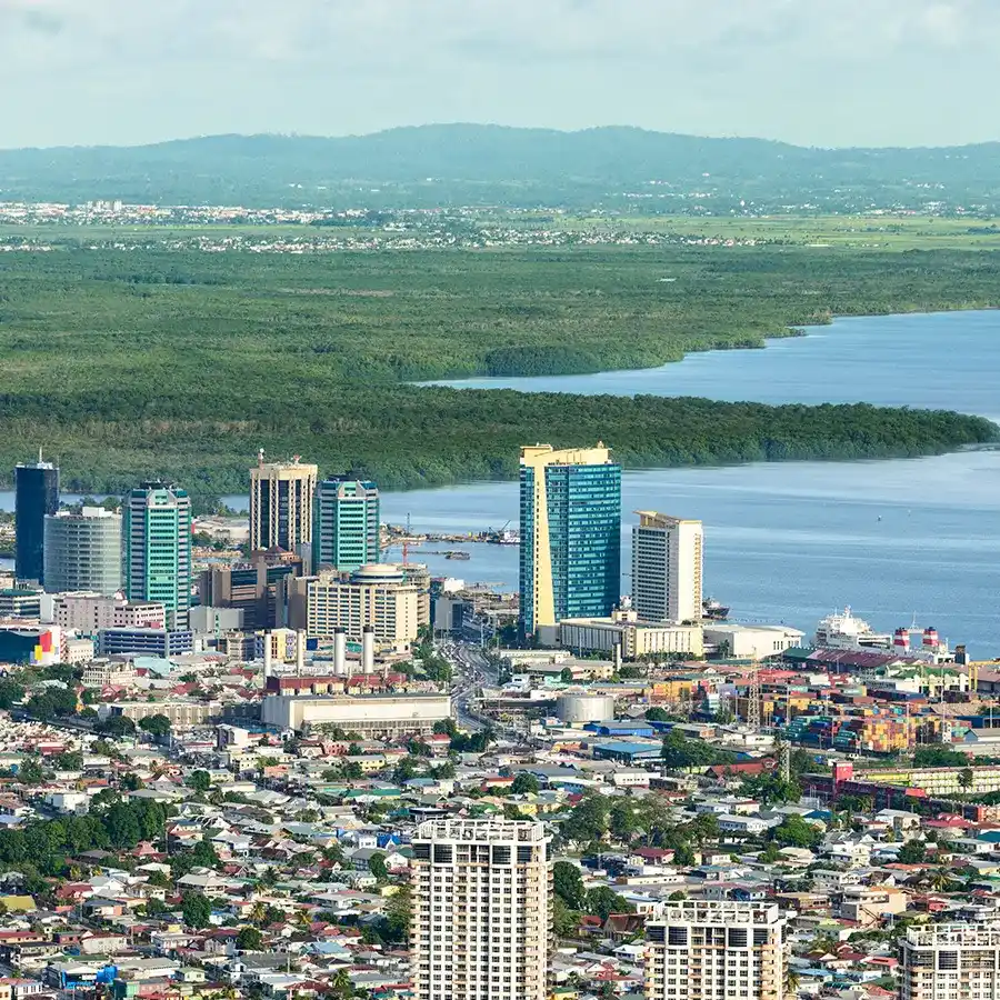 View from above of Skyline downtown Port of Spain city Buildings by the port with Caroni area on the background