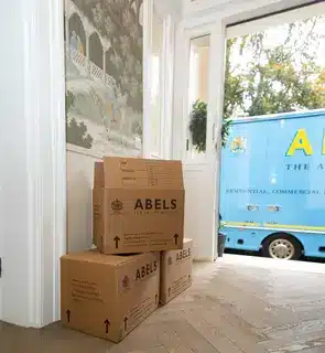 packed boxes in house, removals van outside waiting